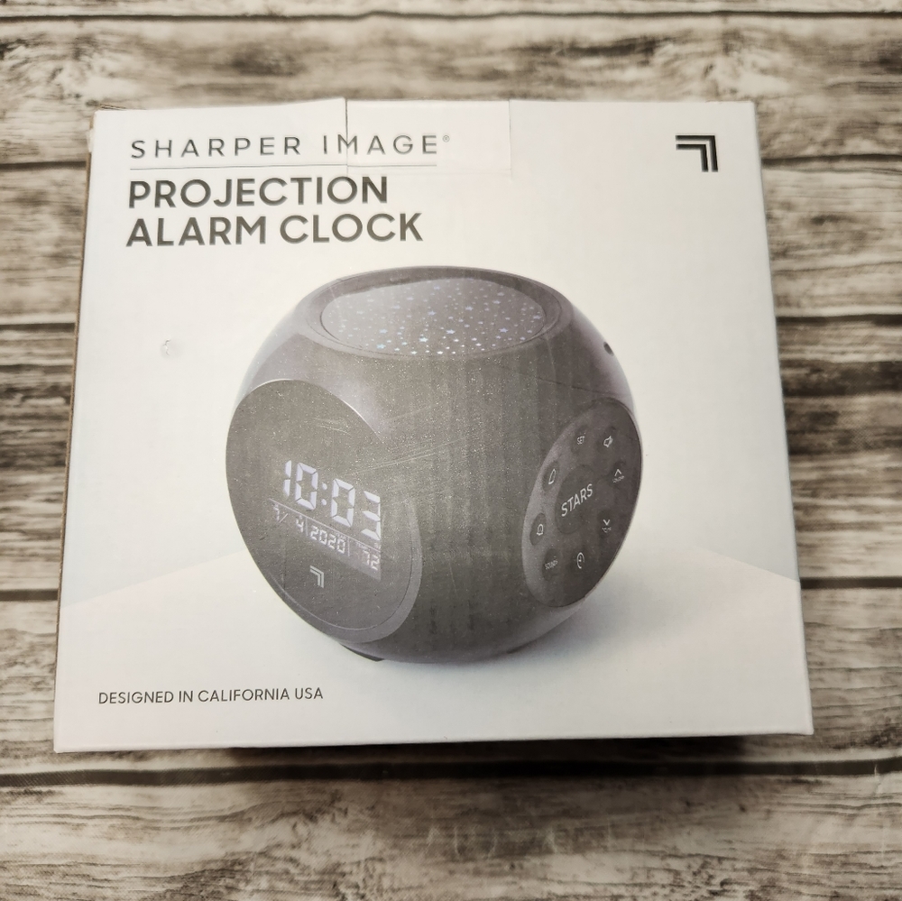 Sharper image projection alarm clock with nature sounds